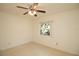 Bedroom with ceiling fan and window at 721 75Th N Ave, St Petersburg, FL 33702
