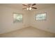 Bedroom featuring a ceiling fan, and two windows at 721 75Th N Ave, St Petersburg, FL 33702