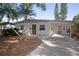 Lovely single-story home with a covered carport and a well-kept walkway leading to the entrance at 721 75Th N Ave, St Petersburg, FL 33702
