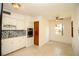 Bright eat-in kitchen features stainless appliances, white cabinets and an adjacent dining area at 721 75Th N Ave, St Petersburg, FL 33702