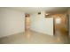 Spacious living room with a neutral paint scheme and terrazzo flooring at 721 75Th N Ave, St Petersburg, FL 33702