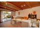 Bright home office with wooden ceiling beams, and large sliding glass doors to the backyard at 721 75Th N Ave, St Petersburg, FL 33702