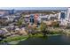 Five-story condo building near a lake with city skyline views in the background at 750 Burlington N Ave # 4L, St Petersburg, FL 33701