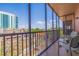 Screened balcony featuring city views with comfortable chairs, great for relaxing outdoors at 750 Burlington N Ave # 4L, St Petersburg, FL 33701