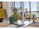 Close up of coffee table and balcony furniture showcasing the city views at 750 Burlington N Ave # 4L, St Petersburg, FL 33701