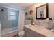Clean bathroom features a shower-tub combination and ample vanity space at 750 Burlington N Ave # 4L, St Petersburg, FL 33701