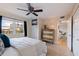 Bright bedroom with comfortable bed, large window, and built in television at 750 Burlington N Ave # 4L, St Petersburg, FL 33701