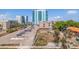 An urban view with a parking lot, buildings and mature landscaping at 750 Burlington N Ave # 4L, St Petersburg, FL 33701