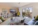 Cozy living room featuring access to balcony with city views at 750 Burlington N Ave # 4L, St Petersburg, FL 33701