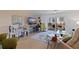 Open-concept living area with comfortable seating and access to an outdoor balcony at 750 Burlington N Ave # 4L, St Petersburg, FL 33701