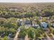 Located in a charming neighborhood with lush trees and river access, this property has great curb appeal from this aerial shot at 7500 N Ola Ave, Tampa, FL 33604