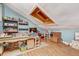 Attic is finished with wood laminate flooring and features a large skylight for natural light at 7500 N Ola Ave, Tampa, FL 33604