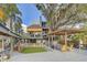 Spacious backyard with a deck, outdoor seating area, and lush green lawn, perfect for entertaining and relaxation at 7500 N Ola Ave, Tampa, FL 33604