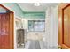 Bathroom with a vanity, patterned curtain, and white tile flooring at 7500 N Ola Ave, Tampa, FL 33604