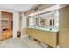 Luxurious bathroom with a modern vanity, dual sinks, and elegant tile flooring at 7500 N Ola Ave, Tampa, FL 33604
