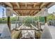 Covered boat lift under the deck featuring Davit Primary lift system and water access at 7500 N Ola Ave, Tampa, FL 33604