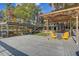 Spacious waterfront dock with gazebo, offering lake access and stunning views from yellow chairs at 7500 N Ola Ave, Tampa, FL 33604