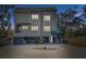 Stunning elevated three-story home with a unique coastal modern architectural style at 7500 N Ola Ave, Tampa, FL 33604