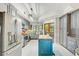 Modern kitchen with stainless steel appliances, gray cabinets and butcher block island at 7500 N Ola Ave, Tampa, FL 33604