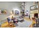 Bright living room featuring hardwood floors, fan, high ceiling, and natural light at 7500 N Ola Ave, Tampa, FL 33604