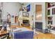 Open living room with a high ceiling, hardwood floors, a fireplace and staircase at 7500 N Ola Ave, Tampa, FL 33604