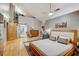 Inviting main bedroom with hardwood floors leads to an ensuite bath and closet at 7500 N Ola Ave, Tampa, FL 33604