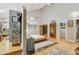 Sun-filled main bedroom boasts hardwood floors, unique decor, and a walk-in closet at 7500 N Ola Ave, Tampa, FL 33604