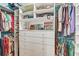 Well-organized walk-in closet offers custom shelving and ample space for clothing at 7500 N Ola Ave, Tampa, FL 33604