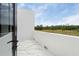 Spacious balcony with marble flooring and scenic views of trees and blue sky at 7608 Antilla St, Tampa, FL 33625