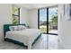 Bright bedroom features large windows with a beautiful view of the outdoors at 7608 Antilla St, Tampa, FL 33625