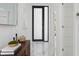 Elegant entryway featuring marble floors, modern door, and stylish decor creating a welcoming ambiance at 7608 Antilla St, Tampa, FL 33625