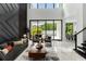 Spacious living room featuring marble floors, modern decor, high ceilings, and a clear view to the pool area at 7608 Antilla St, Tampa, FL 33625