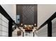 View of the open concept living room and marble floors from the top of a staircase at 7608 Antilla St, Tampa, FL 33625