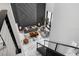 Elevated view of modern living room showcasing marble floors, stylish decor, and an open staircase at 7608 Antilla St, Tampa, FL 33625