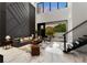 Spacious living room with modern decor, two-story ceilings and a view of the outdoor patio at 7608 Antilla St, Tampa, FL 33625