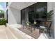 Inviting patio with sleek furniture and sliding glass doors for seamless indoor-outdoor living at 7608 Antilla St, Tampa, FL 33625
