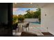 A view of the patio and pool from the open sliding glass door at 7608 Antilla St, Tampa, FL 33625