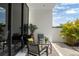 Stylish patio area featuring modern furniture, a decorative rug and lush greenery at 7608 Antilla St, Tampa, FL 33625