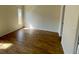 Bright bedroom with wood-look tile flooring and natural light at 8608 Twin Farms Pl, Tampa, FL 33635