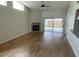 Bright living room with tile floors, fireplace, high ceilings, and sliding glass doors to the outside at 8608 Twin Farms Pl, Tampa, FL 33635
