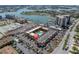 Aerial view of building, nearby docks, water, pool, and surrounding buildings at 10365 Paradise Blvd # 4, Treasure Island, FL 33706