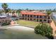 Exterior view of backyard featuring patio, lawn, and bay access at 10365 Paradise Blvd # 4, Treasure Island, FL 33706