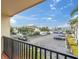 Balcony overlooking a parking lot and palm trees at 10365 Paradise Blvd # 4, Treasure Island, FL 33706