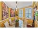 An elegant dining room featuring a glass table, chair seating and sunlit windows at 1200 Country Club Dr # 5404, Largo, FL 33771