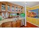 Gourmet kitchen featuring stainless steel appliances, custom cabinetry, and a stylish island with seating at 1200 Country Club Dr # 5404, Largo, FL 33771