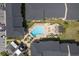 Aerial view of community pool, lounge chairs, and pergola area at 12293 Sailwinds Dr # 206, Largo, FL 33773