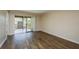 Room featuring sliding glass doors that lead to a balcony with a neighborhood view at 12293 Sailwinds Dr # 206, Largo, FL 33773