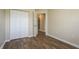 Bedroom with vinyl floors, neutral walls, and closet with double doors at 12293 Sailwinds Dr # 206, Largo, FL 33773