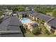 Aerial view of community pool, lounge chairs, and pergola area at 12293 Sailwinds Dr # 206, Largo, FL 33773