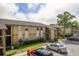 Exterior view of apartment building with landscaping and parking at 12293 Sailwinds Dr # 206, Largo, FL 33773